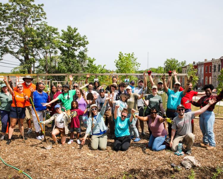 people smiling in a group picture after a native plant donation event
